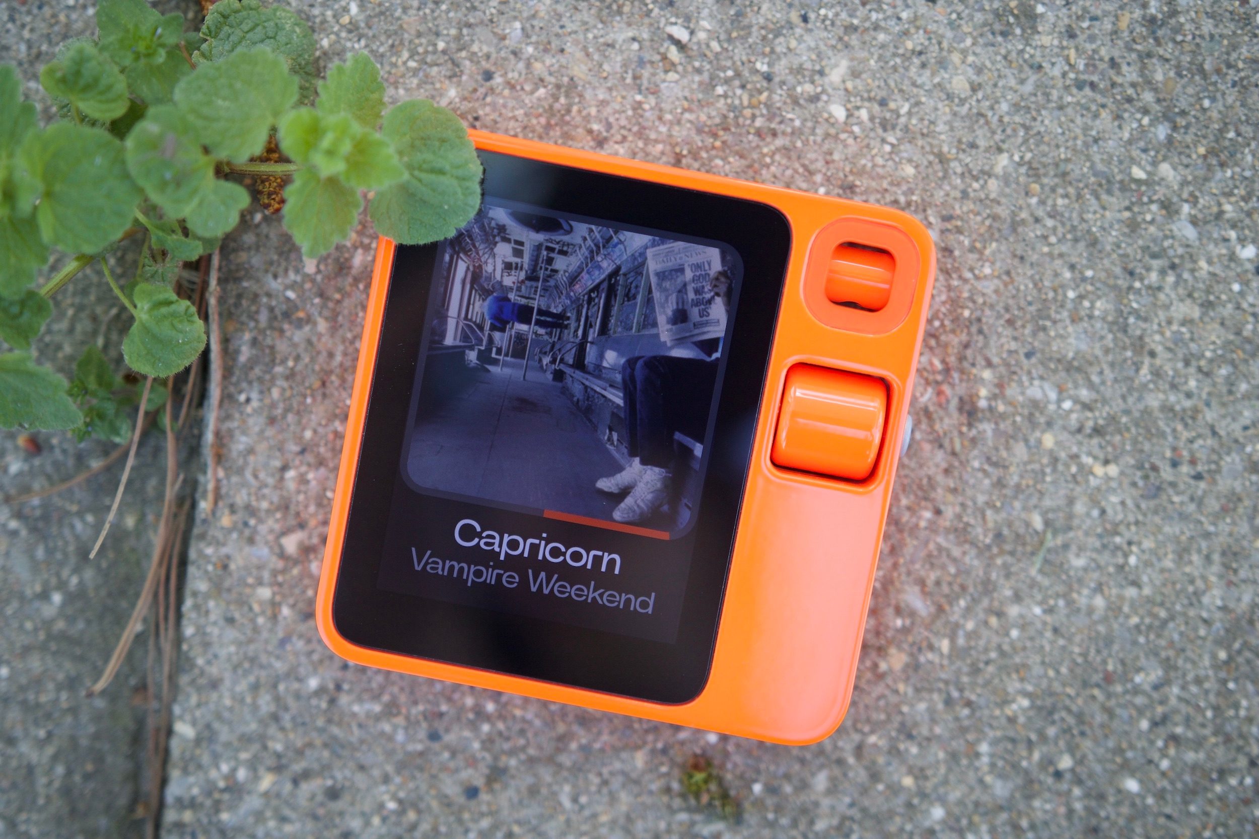 The Rabbit R1 playing a Vampire Weekend song via Spotify.