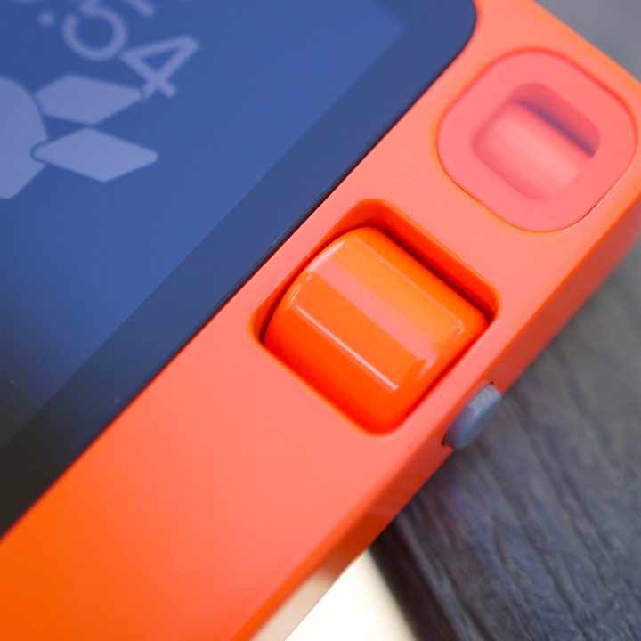 A close-up of the Rabbit R1, showing its scroll wheel.