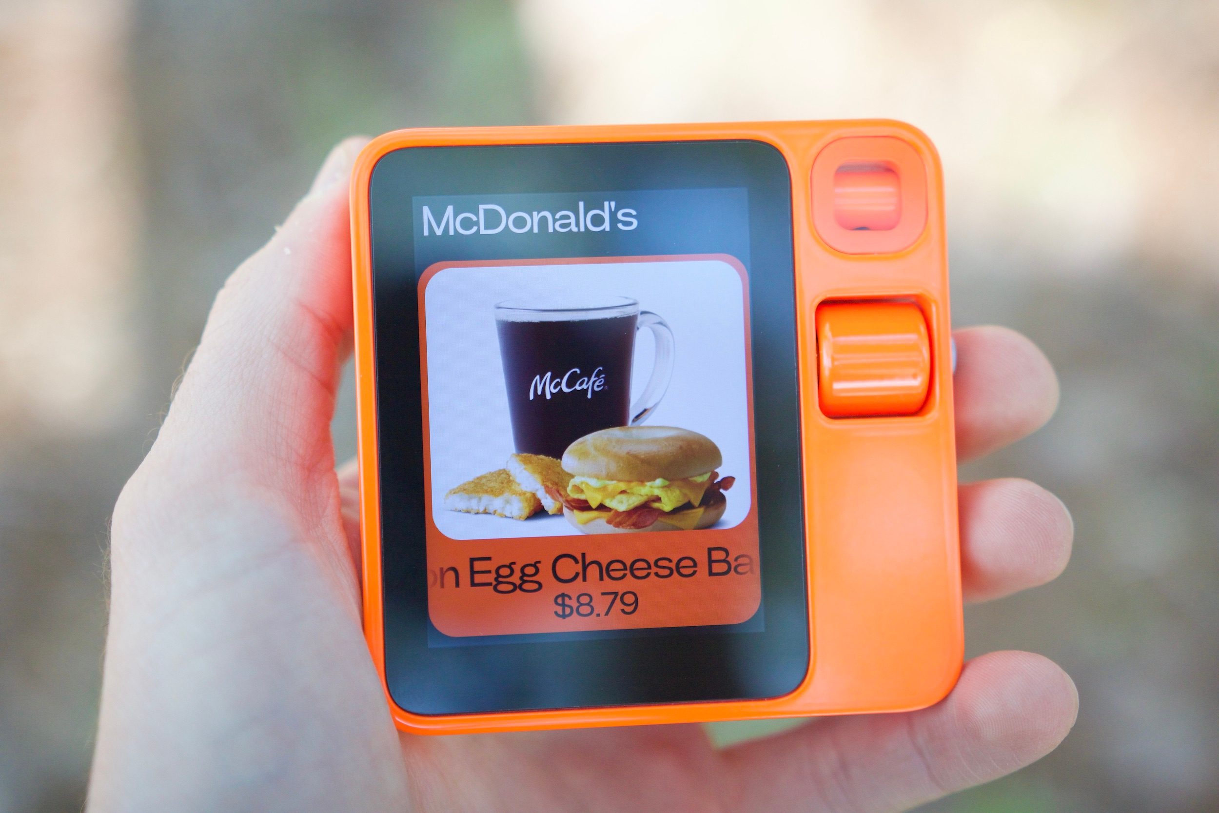 Looking at a McDonalds menu on DoorDash on the Rabbit R1.