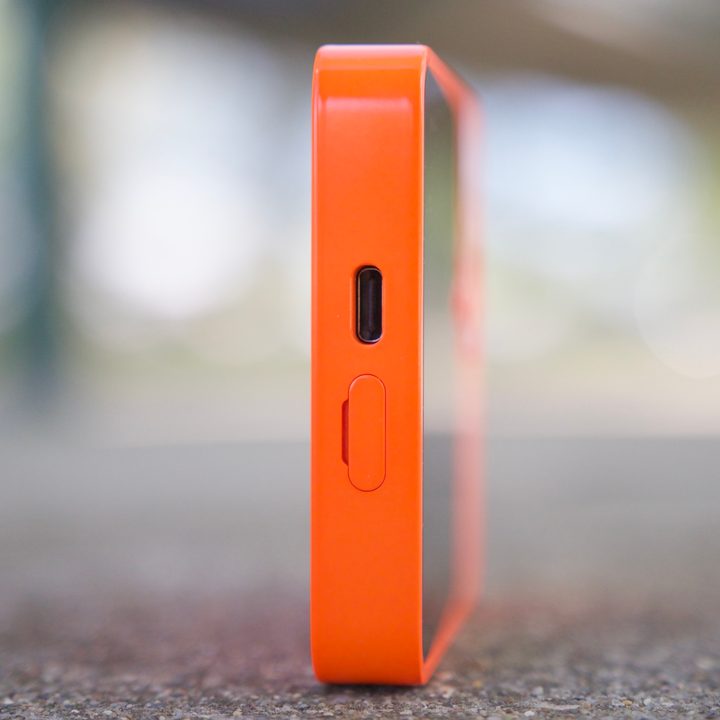 A side view of the Rabbit R1, showing its USB-C charging port.