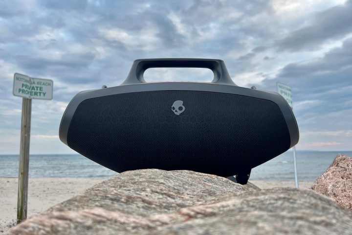 The Skullcandy Barrel Bluetooth speaker on a rock.