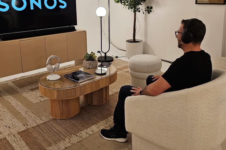 Simon Cohen wearing the Sonos Ace in a home theater demo room.