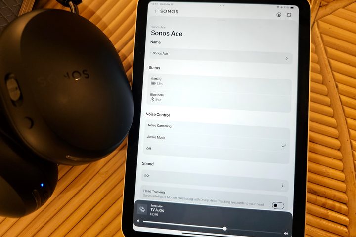 Sonos Ace beside Apple iPad running the Sonos app.