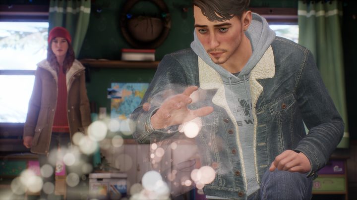 Tyler's hand is hovering over unusual looking orbs while Alyson looks on in the background.