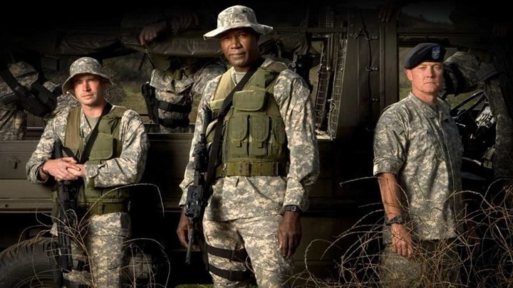 Three soldiers posing in a promo image from the series The Unit.