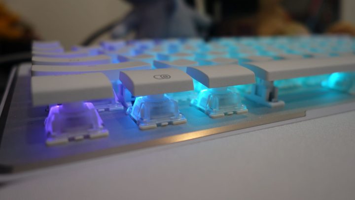 The underside of the Vulcan 2 TKL Pro's keys glow blue.