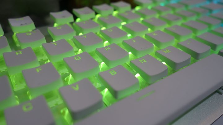 The Vulcan 2 TKL Pro glows green.