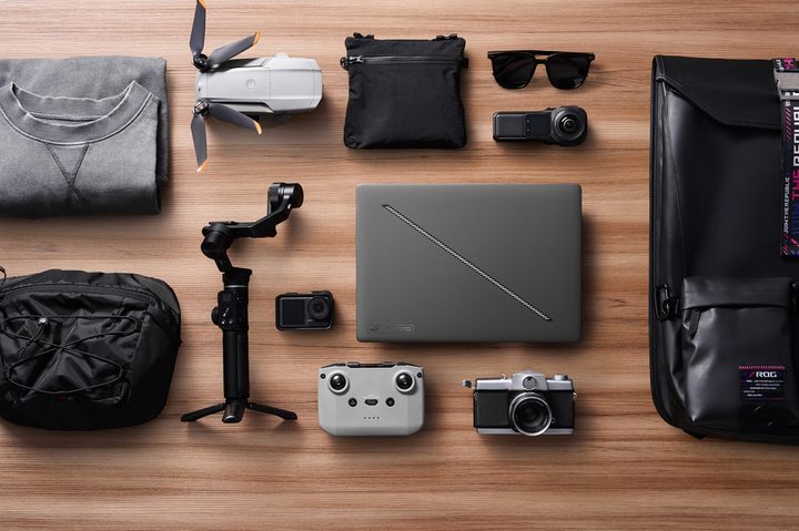The Asus ROG Zephyrus G16 sitting among various other items.