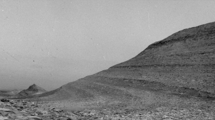 The specks in this scene were caused by charged particles from a solar storm hitting a camera aboard NASA&rsquo;s Curiosity Mars rover. Curiosity uses its navigation cameras to try and capture images of dust devils and wind gusts, like the one seen here.