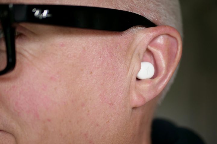 A person wearing the 1More Z30 Sleeping Earbuds.