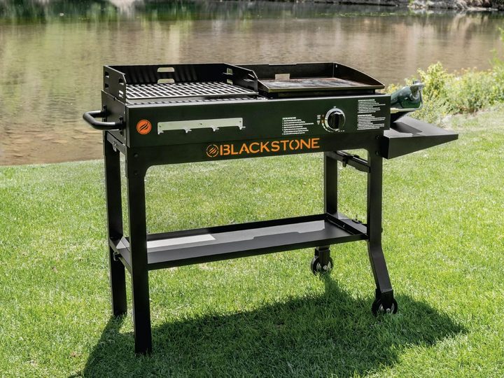 The Blackstone Duo 17-inch Propane Griddle and Charcoal Grill out on the lake.