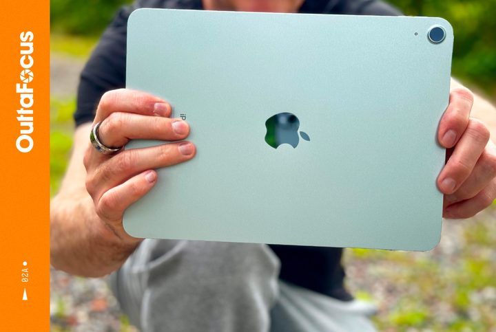 A person holding the iPad Air (2024) and taking a photo.