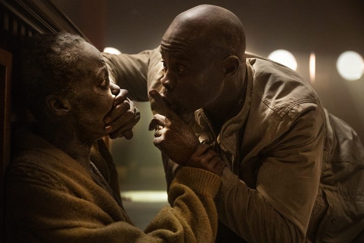 Djimon Hounsou keeps Lupita Nyong'o quiet in A Quiet Place: Day One.