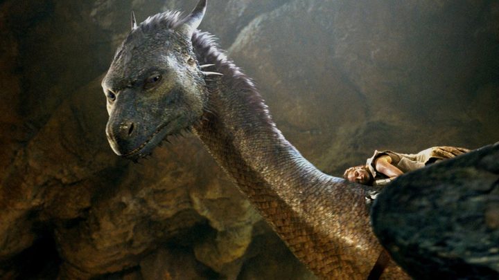 A dragon looking down at something in Eragon,