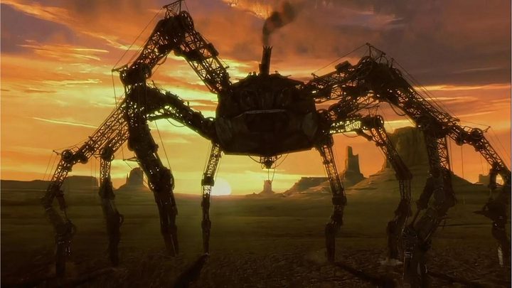 A giant mechanical spider against a sunset in Wild Wild West.