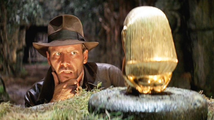 Indiana Jones contemplating how to take an artifact without setting off a trap in Raiders of the Lost Ark.