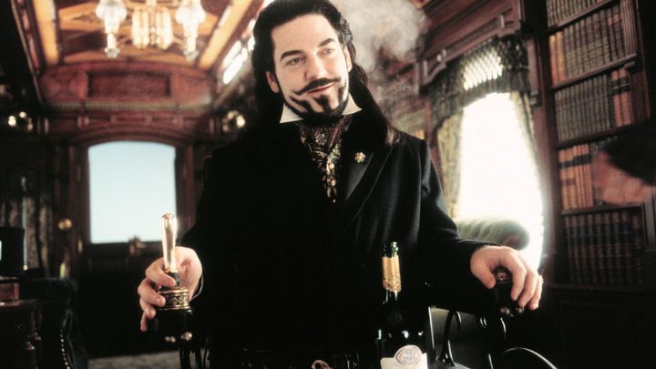 Kenneth Branagh as Arliss Loveless aboard a train in Wild Wild West.