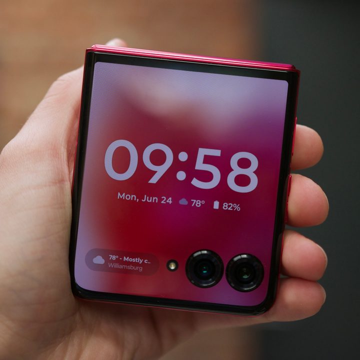 Someone holding the Motorola Razr Plus 2024 with the phone closed.
