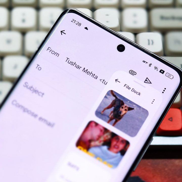 File Dock on Realme GT 6 held in hand in front of a white mechanical keyboard.