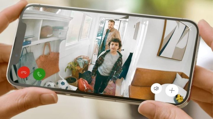A smartphone using the Ring app to view a live stream.
