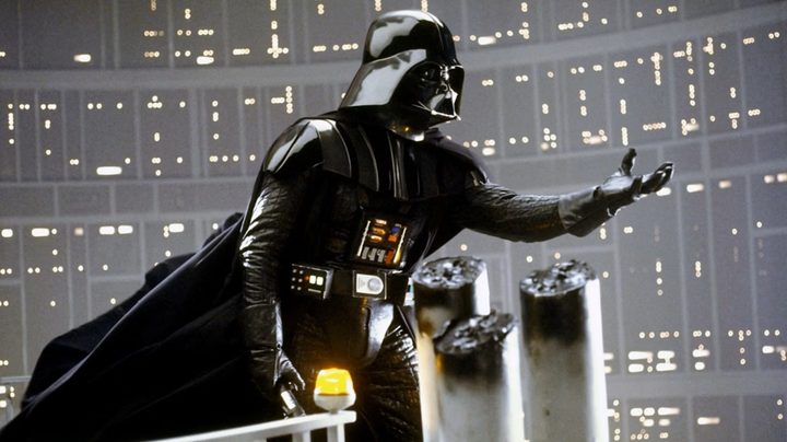 Darth Vader reaching out his hand to Luke Skywalker in Star Wars: The Empire Strikes Back.