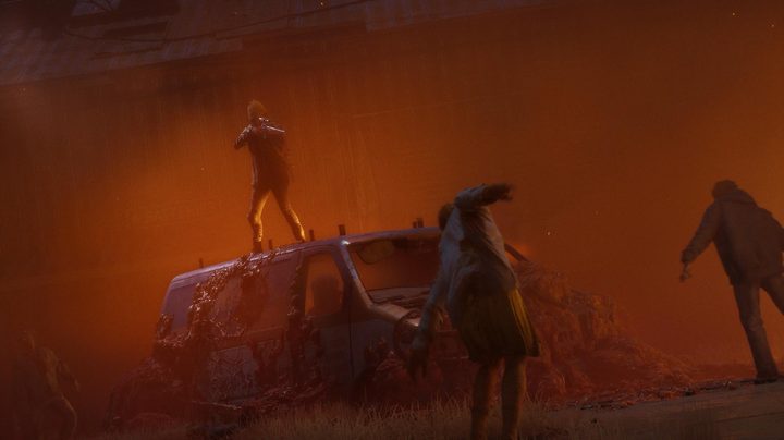 A survivor shoots into a crowd of zombies from the top of a van.
