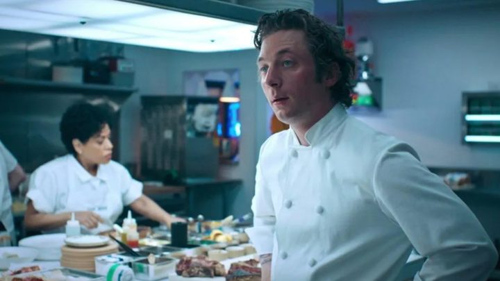 A chef stands in the kitchen and stares.