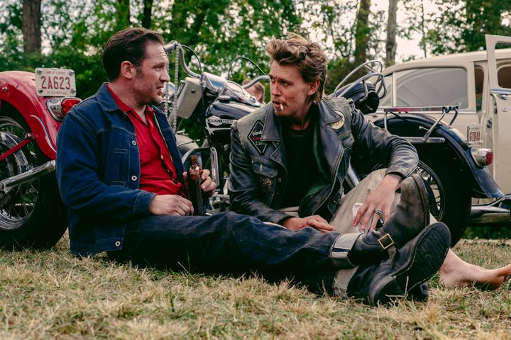 Tom Hardy sits with Austin Butler in The Bikeriders.