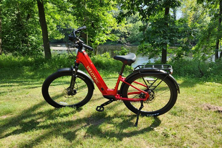 Velotric Discover 2 left profile view with parked by next to the Farmington River.