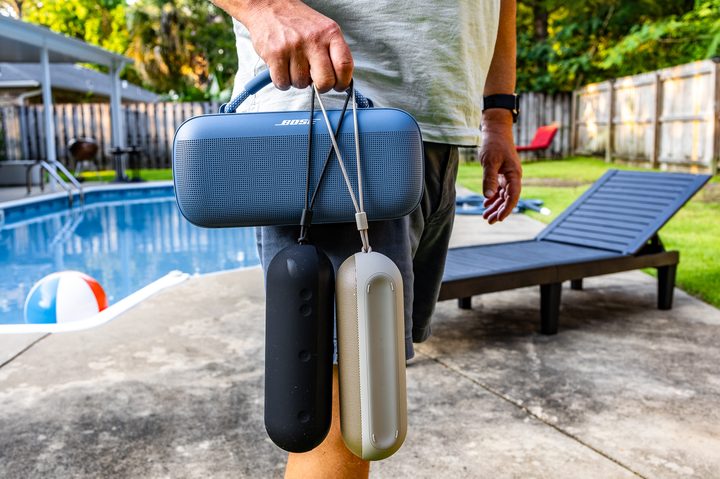 Phil Nickinson carrying the Bose SoundLink Max and two Beats Pill speakers.