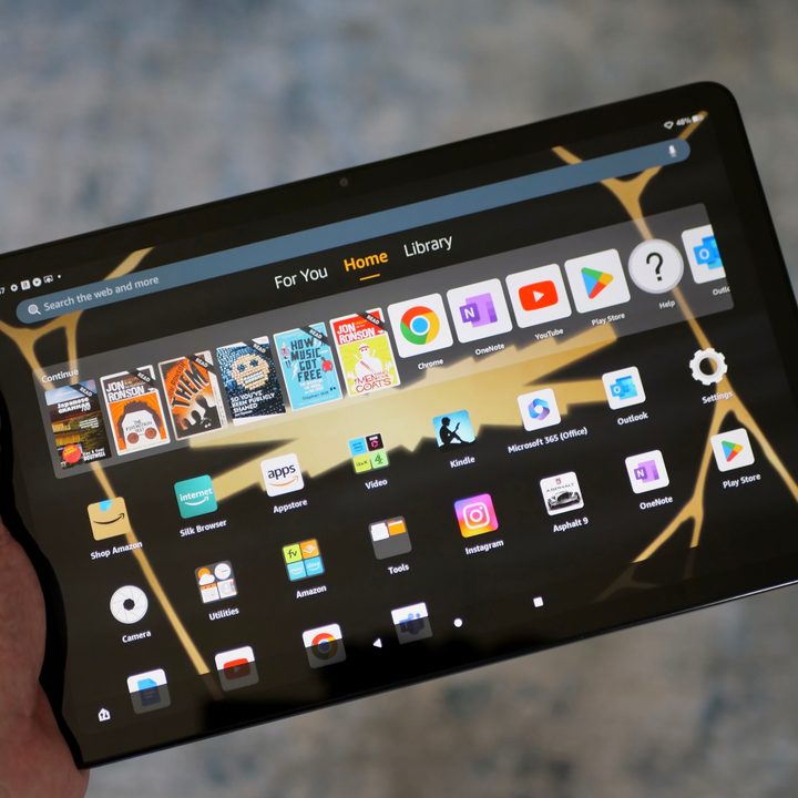 A person holding the Amazon Fire Max 11.