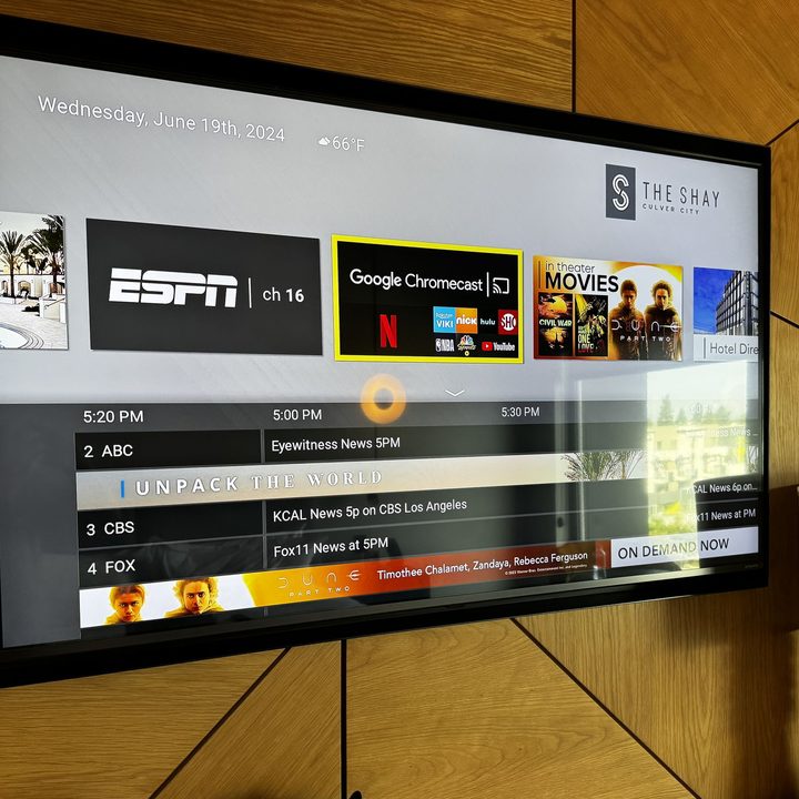 A hotel TV showing the option to use Chromecast (Google Cast).