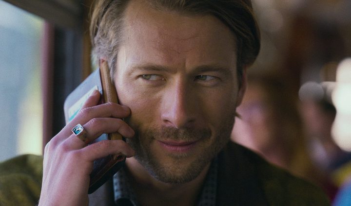 A man talk on his phone in Hit Man.