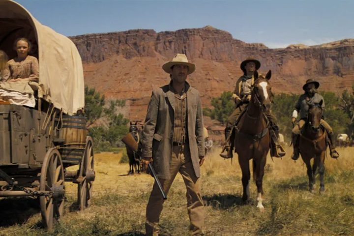 Cowboys stands in a field in Horizon: An American Saga.