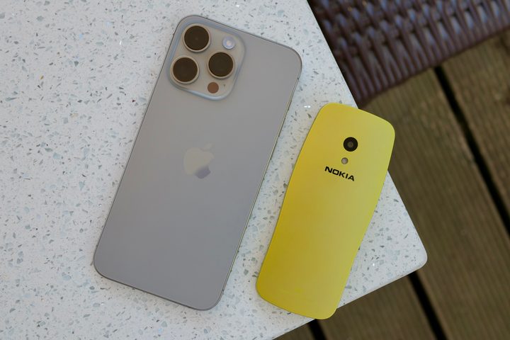 The Nokia 3210 with an Apple iPhone 15 Pro Max.