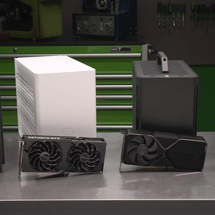 Several mini PCs lined up with Nvidia GPUs in front.