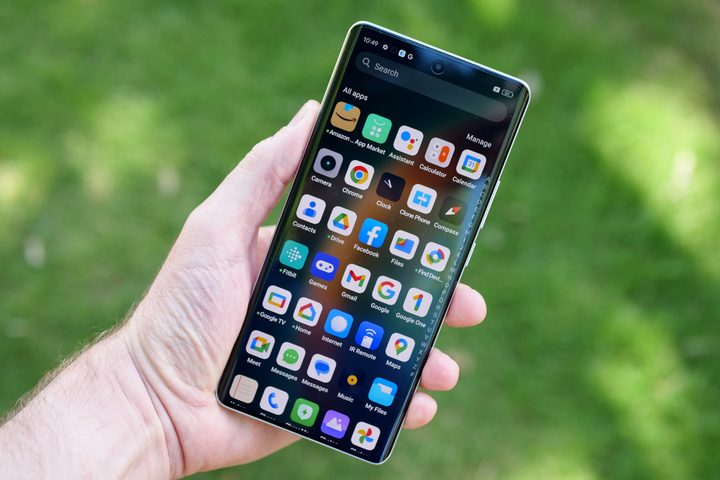 A person holding the Realme GT 6 showing the screen.