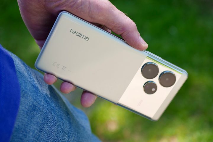 A person holding the Realme GT 6.