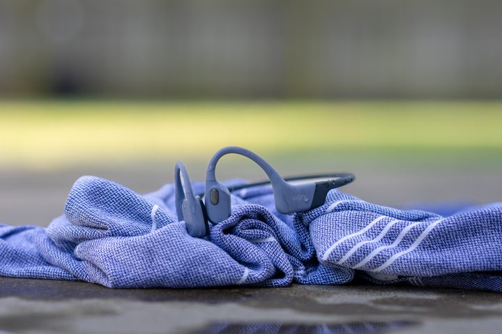 Shokz OpenSwim Pro on a towel.