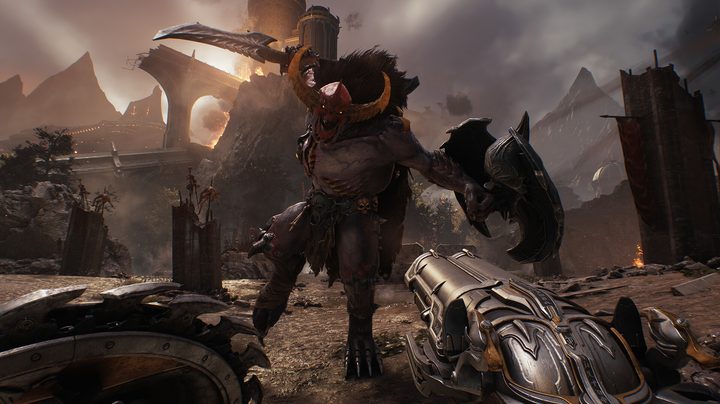 A demon with a sword attacking doomslayer.