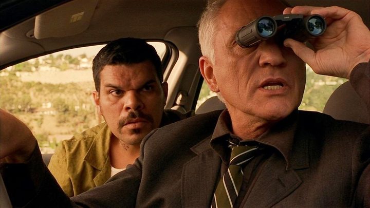 Two men spy from a car in The Limey.