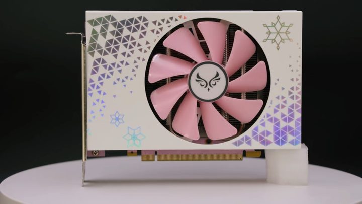 The RTX 4070 ITX Sakura Blizzard graphics card standing up.