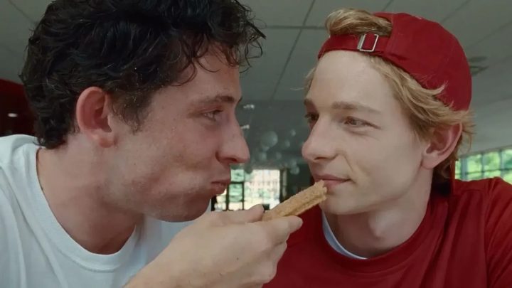 A guy offers another guy his churro in Challengers.