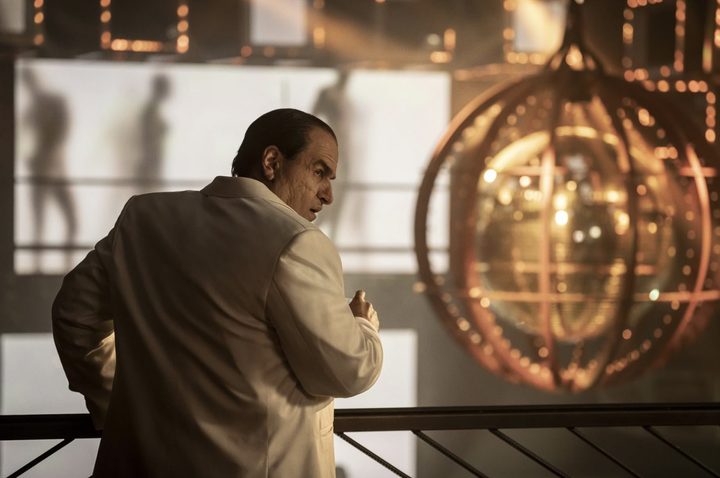Colin Farrell looks behind him and stares.