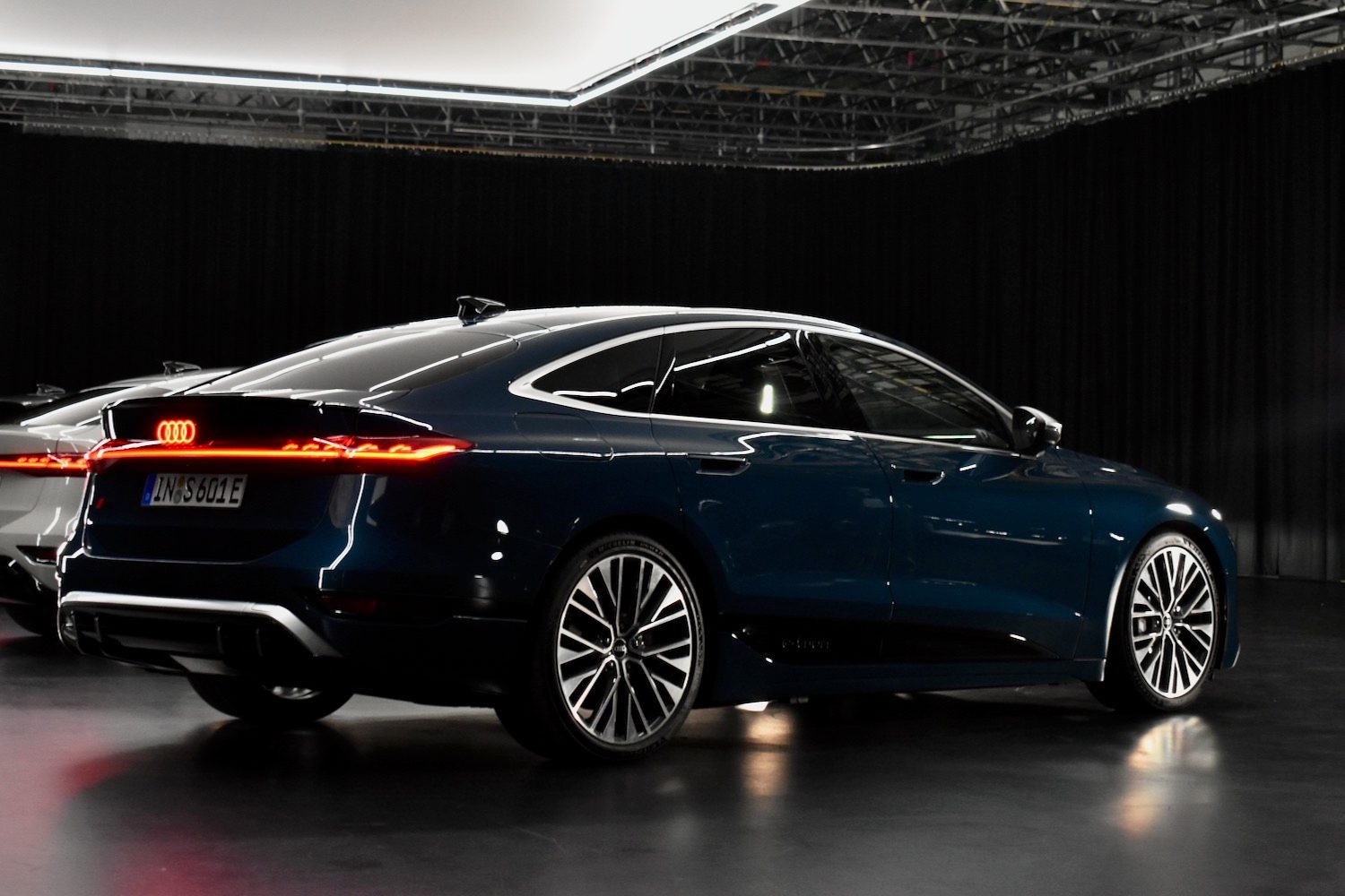 Rear three quarter view of a 2025 Audi A6 e-tron sedan.