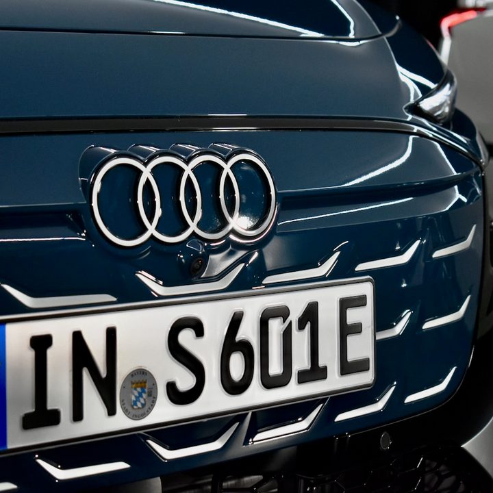 Audi logo on a 2025 A6 e-tron grille.