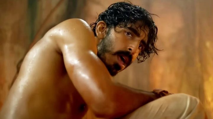 Dev Patel as Kid shirtless and looking sweaty and tired in Monkey Man.