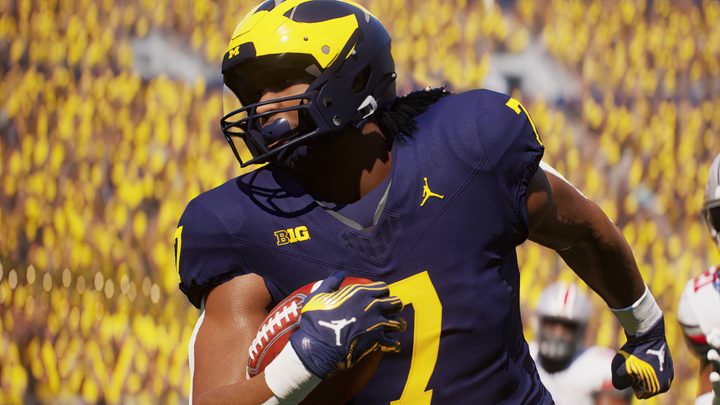A player holds a football in EA Sports College Football 25.