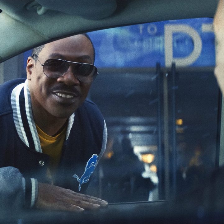 Eddie Murphy smiles at Paul Reiser in "Beverly Hills Cop: Axel F."