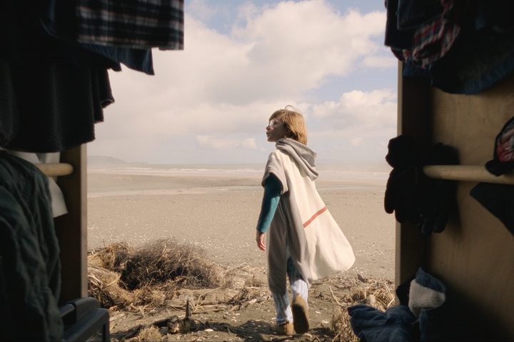 Kevin walks onto a beach through his wardrobe in Time Bandits.